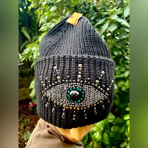 Black Beanie with Eye Design by Kurt Geiger.
NWOT - Picture 3 of 17